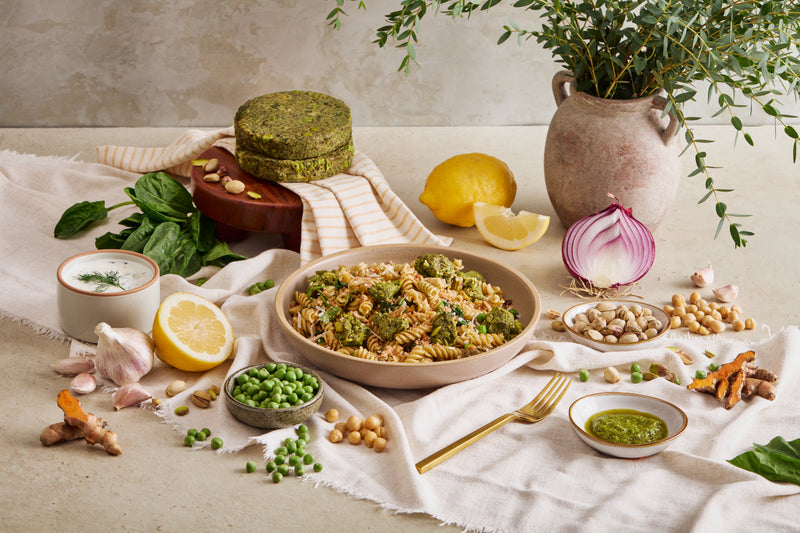 Spinach and pistachio patties served with pasta